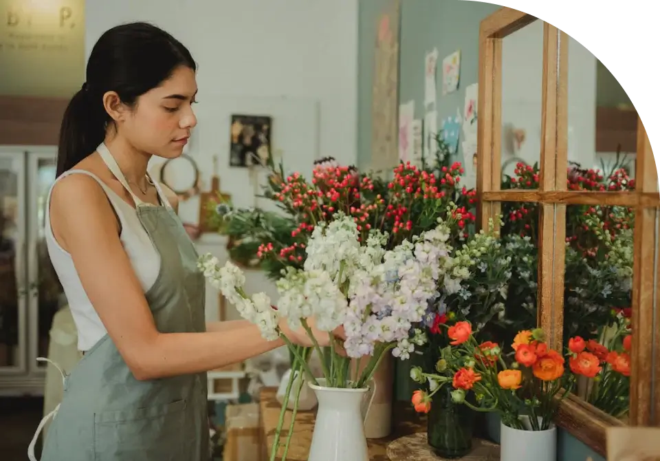 Florist preparing a fresh flower arrangement